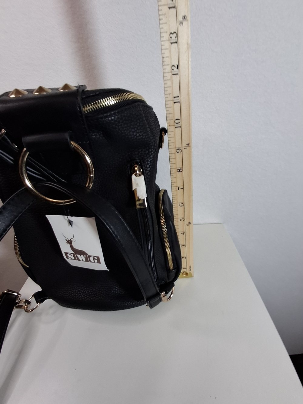 SWG Black Pebbled Sling Barrel Backpack with Gold Accents - Picture 9 of 11